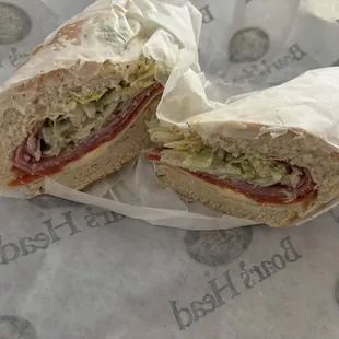 Italian sub cut in half and wrapped
