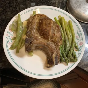 a plate of steak and asparagus