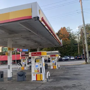 a gas station with gas pumps