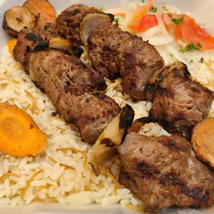 a plate of meat and rice