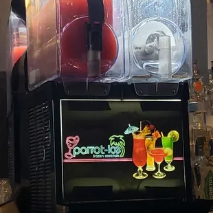 a drink dispenser on a bar counter
