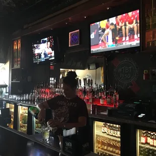 a man serving drinks