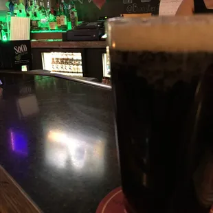 a pint of beer on the bar