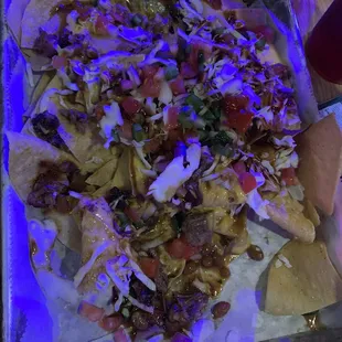 Nachos with tiny pieces of jalapeños