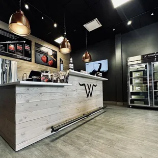 a counter with a tv in the background