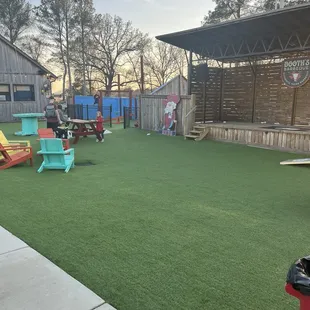 The kids play area and stage area of the yard