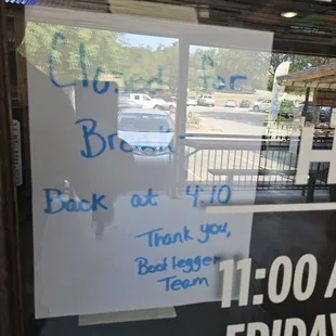 Sign violating posted business hours