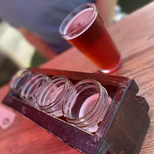 a shot of beer in a bootlegger's glass