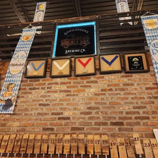 a brick wall with beer taps