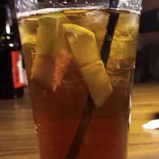 a glass of iced tea on a table