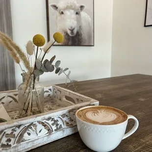 a cup of cappuccino on a table