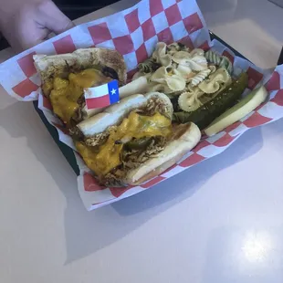 a hot dog with cheese and pickles