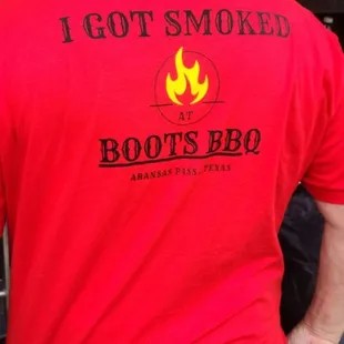 the back of a man wearing a red shirt