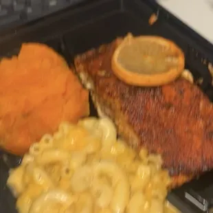 a plate of food with macaroni and cheese