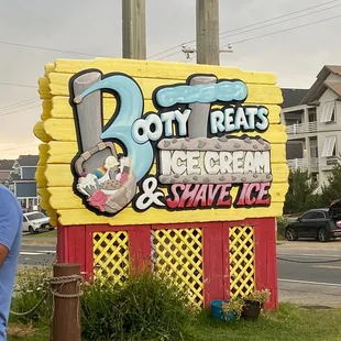a man standing in front of a sign