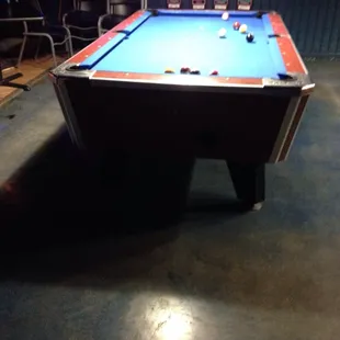 a pool table in a bar
