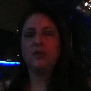 a woman in a car at night