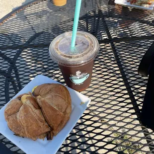 Croissant breakfast sandwich and delicious ice coffee.