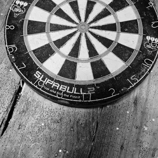 a dart in the center of a dart board