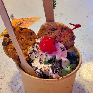 an ice cream sundae with a cherry on top