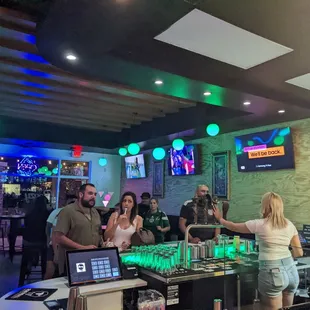a group of people at a bar