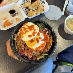 Hot stone San San-Chae Bibimbap with Bulgogi , gyoza and miso soup.