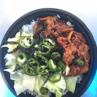 Spicy pork is an owner's favorite. Pork marinated in a spicy sauce topped with seaweed, lettuce, and Korean peppers