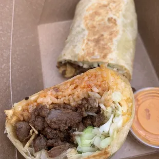 a burrito in a takeout box
