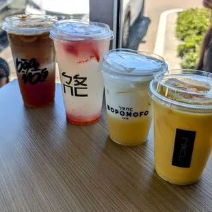 Large coffee milk tea, large Strawberry Basil Ginger Lemonade, Strawberry Corn Milk, and Orange Wang