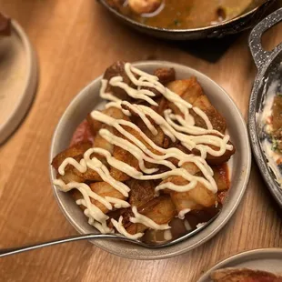 Patatas bravas (crispy potatoes, salsa brava, pimentón, garlic allioli)