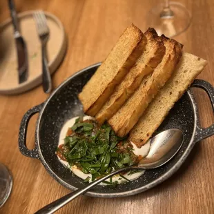 Escalivada (fire roasted eggplant, red pepper, onion, labne yogurt, fresh herbs and olive oil, served with focaccia)