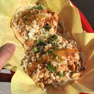 a person holding a plate of food