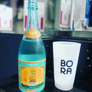 a bottle and a glass