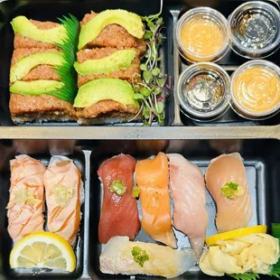 two trays of sushi with different toppings