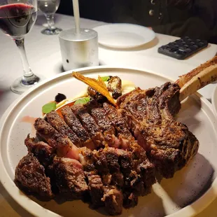 a plate of food and a glass of wine