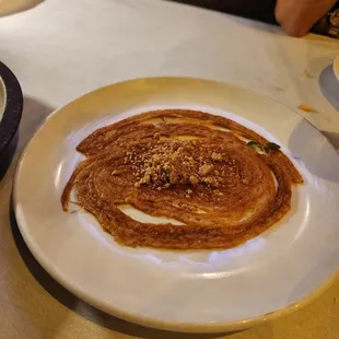 a crepe on a plate on a table