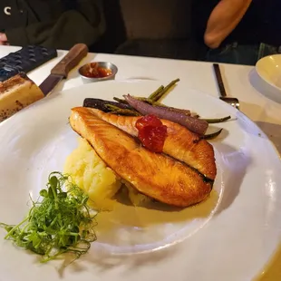 a plate of fish and mashed potatoes