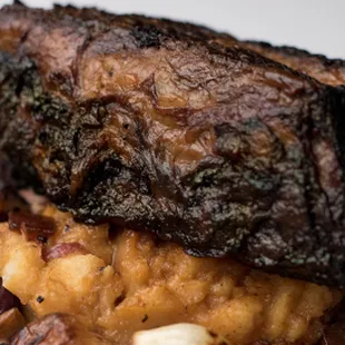 a plate of food with meat and vegetables