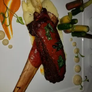 T-rex rib with mashed potatoes and puree