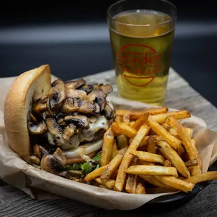a plate of fries and a glass of beer