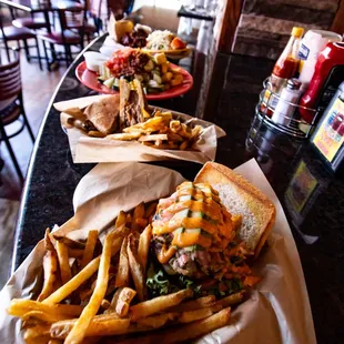 a table with fries and a sandwich