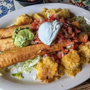 Three beef flautas with guac and sour cream. I asked for corn cakes instead of the rice and beans. :)