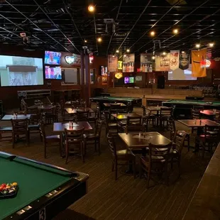 a pool table and televisions