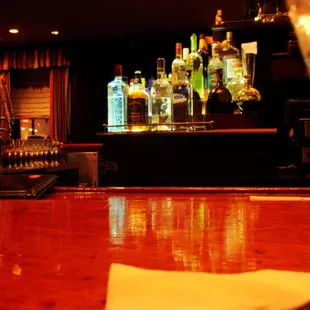 a bar with liquor bottles