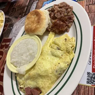 Polish omelette with grits and side of corn beef hash