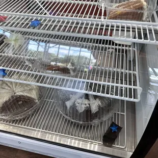 the inside of a bakery display case