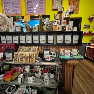 a shelf of coffee mugs