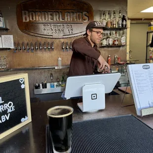 a bartender at the bar