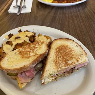 Cuban sandwich with queso tots