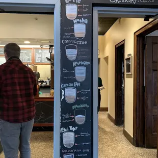 a man walking into a coffee shop